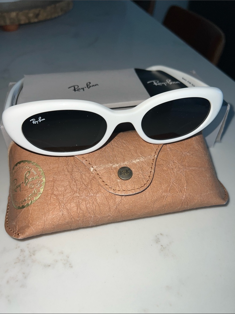 Ray-Ban Women’s White Oval Sunglasses with Black Lenses